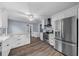 Bright kitchen with white cabinets, stainless steel appliances, and modern countertops at 4040 E Fort King St, Ocala, FL 34470