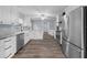 Spacious kitchen with white cabinetry, granite countertops, and stainless steel appliances at 4040 E Fort King St, Ocala, FL 34470