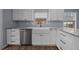 Stylish kitchen featuring white cabinetry, granite countertops, and stainless steel dishwasher at 4040 E Fort King St, Ocala, FL 34470