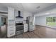 Updated kitchen showcasing stainless steel appliances and a view to the backyard at 4040 E Fort King St, Ocala, FL 34470