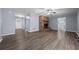 Living room with fireplace with access to front door and kitchen area at 4040 E Fort King St, Ocala, FL 34470