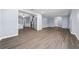 Open-concept layout with wood-look floors connecting living and kitchen areas at 4040 E Fort King St, Ocala, FL 34470