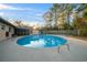 Beautiful pool surrounded by lush landscaping creates a private backyard oasis at 4040 E Fort King St, Ocala, FL 34470