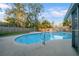 Private pool area is surrounded by lush greenery at 4040 E Fort King St, Ocala, FL 34470