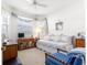 Bright bedroom boasts a daybed, vintage decor, and ample natural light at 10055 Sw 90Th Loop, Ocala, FL 34481