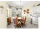 Cozy breakfast nook features a round table, four chairs, and natural light from the window at 10055 Sw 90Th Loop, Ocala, FL 34481