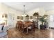 Charming dining area with a wood table, cabinet, and natural lighting, ideal for Gathering gatherings at 10055 Sw 90Th Loop, Ocala, FL 34481