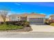 Charming home with a well-manicured front yard and inviting curb appeal on a sunny day at 10055 Sw 90Th Loop, Ocala, FL 34481