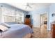 Bright primary bedroom features a window and access to an ensuite bathroom at 10055 Sw 90Th Loop, Ocala, FL 34481