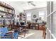 A bright office with a ceiling fan, two windows, and large, full bookshelves at 10055 Sw 90Th Loop, Ocala, FL 34481