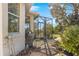 Outdoor patio with grill and screened-in lanai at 10055 Sw 90Th Loop, Ocala, FL 34481