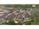 Aerial view of cozy residential neighborhood with colorful homes and well-maintained landscaping at 1019 Avalon Ave, Lady Lake, FL 32159