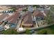 Aerial view of home with well-manicured landscaping and peach-colored exterior at 1019 Avalon Ave, Lady Lake, FL 32159