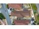 Aerial view of homes with well-manicured landscaping and brown roofs at 1019 Avalon Ave, Lady Lake, FL 32159