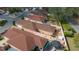 A high-angle view shows well-maintained yards and the roofs of houses in a neat neighborhood at 1019 Avalon Ave, Lady Lake, FL 32159