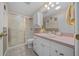 Functional bathroom with a tiled shower, vanity with storage, and a clean, well-maintained design at 1019 Avalon Ave, Lady Lake, FL 32159