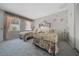 Charming bedroom featuring two twin beds with floral bedding and coordinated wallpaper at 1019 Avalon Ave, Lady Lake, FL 32159