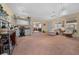 Large bonus room with carpet flooring and a dedicated desk area, perfect for work or hobbies at 1019 Avalon Ave, Lady Lake, FL 32159