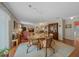 Dining area with classic furniture and a view into the living room at 1019 Avalon Ave, Lady Lake, FL 32159