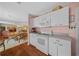 Bright kitchen with white cabinets, modern appliances, and open layout at 1019 Avalon Ave, Lady Lake, FL 32159
