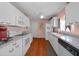 Well-lit kitchen featuring white appliances and plenty of counter space at 1019 Avalon Ave, Lady Lake, FL 32159