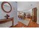 Cozy living space with a dining area, vintage decor, and hardwood floors at 1019 Avalon Ave, Lady Lake, FL 32159