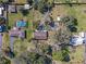 Aerial view showcasing the property, including pool, yard, and neighborhood at 10376 Se 43Rd Ct, Belleview, FL 34420