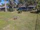Large backyard featuring pool, sheds, and a fire pit at 10376 Se 43Rd Ct, Belleview, FL 34420