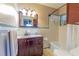 Bathroom with a vanity, mirror, and shower at 10376 Se 43Rd Ct, Belleview, FL 34420