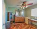 Bedroom with a dresser and a closet with green walls at 10376 Se 43Rd Ct, Belleview, FL 34420
