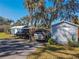 View of the car port and storage shed at 10376 Se 43Rd Ct, Belleview, FL 34420