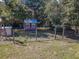 Backyard featuring chicken coop, and windmill at 10376 Se 43Rd Ct, Belleview, FL 34420