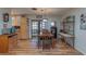 Inviting dining room with table, chairs, laminate floors, and sliding doors at 10376 Se 43Rd Ct, Belleview, FL 34420