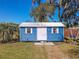 Shot of the blue storage shed with white trim at 10376 Se 43Rd Ct, Belleview, FL 34420