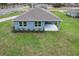 New construction home featuring a covered patio and a spacious backyard at 10512 Sw 49Th Avenue Rd, Ocala, FL 34476