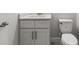 This bathroom features a toilet, sink, vanity, and hardware at 10512 Sw 49Th Avenue Rd, Ocala, FL 34476