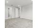 Carpeted bedroom with multiple doorways showcasing easy flow to adjacent living spaces at 10512 Sw 49Th Avenue Rd, Ocala, FL 34476