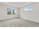Sunlit bedroom with neutral carpet, large windows, and plenty of natural light at 10512 Sw 49Th Avenue Rd, Ocala, FL 34476