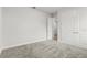 This carpeted room features base molding, a closet, and neutral paint at 10512 Sw 49Th Avenue Rd, Ocala, FL 34476