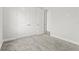 This carpeted bedroom features base molding and a closet at 10512 Sw 49Th Avenue Rd, Ocala, FL 34476