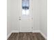 Bright entryway with wood-look flooring and a stylish front door at 10512 Sw 49Th Avenue Rd, Ocala, FL 34476