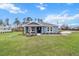Charming single-story home with blue siding, manicured lawn, and fresh landscaping at 10512 Sw 49Th Avenue Rd, Ocala, FL 34476