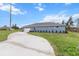 This house features blue siding and a driveway at 10512 Sw 49Th Avenue Rd, Ocala, FL 34476