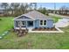 Charming single-story home with a covered porch and fresh landscaping at 10512 Sw 49Th Avenue Rd, Ocala, FL 34476