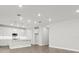 Bright, modern kitchen with white cabinets and a large island at 10512 Sw 49Th Avenue Rd, Ocala, FL 34476