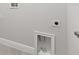 This laundry room features base molding and utility connections at 10512 Sw 49Th Avenue Rd, Ocala, FL 34476