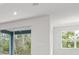 Open-concept living area featuring large windows and sliding glass doors at 10512 Sw 49Th Avenue Rd, Ocala, FL 34476