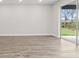 Bright living room with sliding glass doors leading to outdoor space at 10512 Sw 49Th Avenue Rd, Ocala, FL 34476
