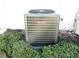 Goodman air conditioning unit surrounded by green bushes, providing efficient home cooling at 11552 Sw 138Th Ln, Dunnellon, FL 34432