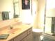 Bathroom with sink and vanity, toilet, and glass shower at 11552 Sw 138Th Ln, Dunnellon, FL 34432